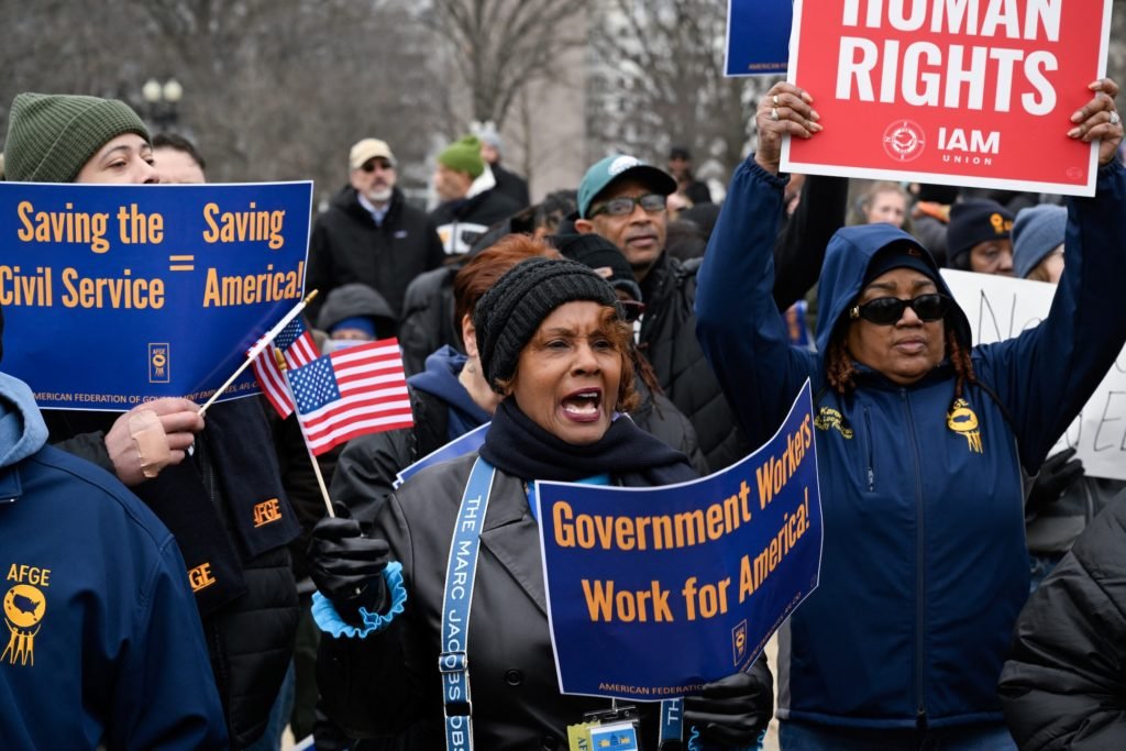 Labor union activists rally in support of federal workers during a protest on Capitol Hill, in Washington