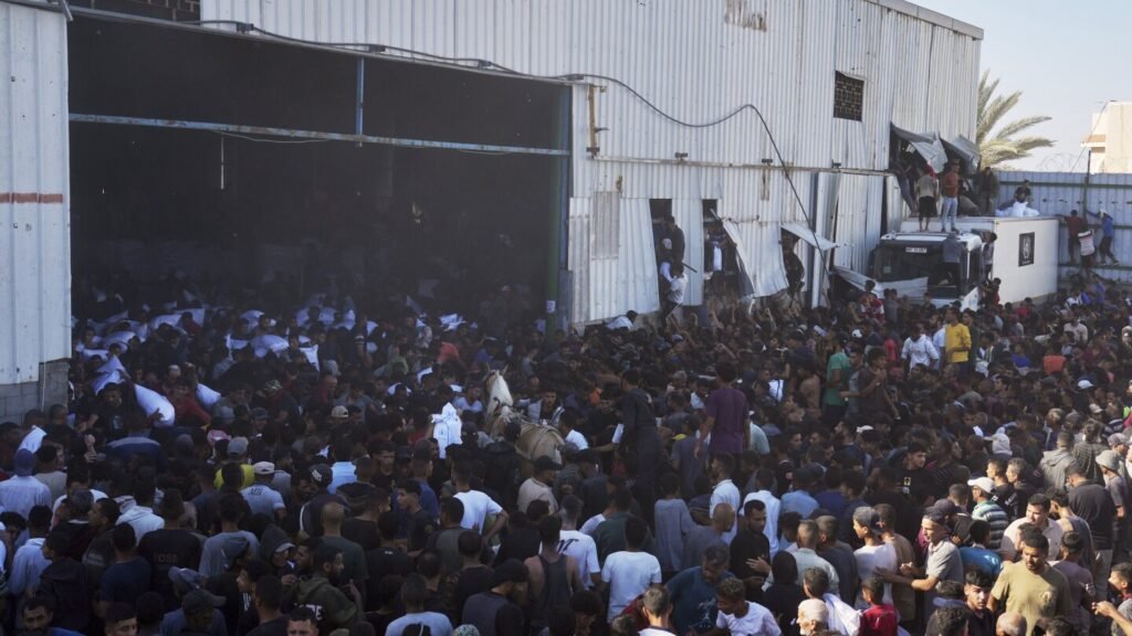 Four Palestinians die in storming of UN food warehouse a day after gunfire at new Gaza aid site