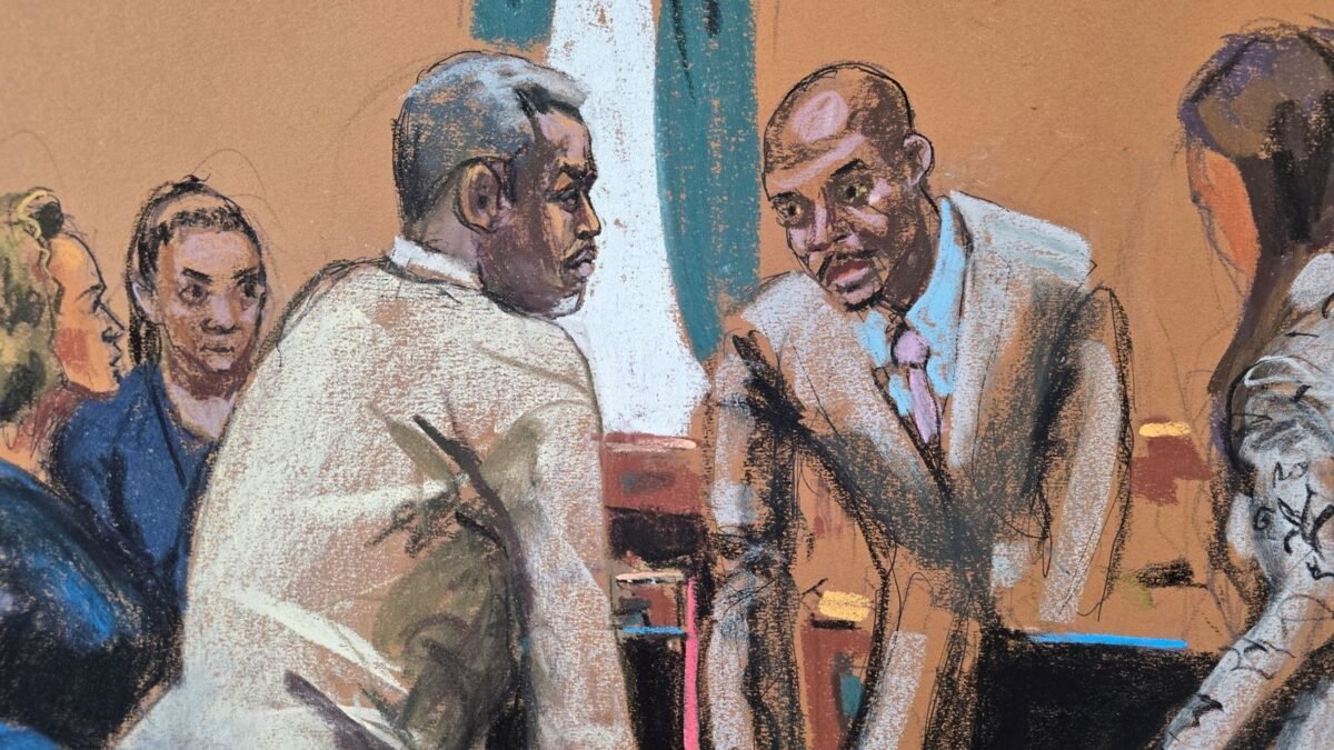 Sean "Diddy" Combs speaks to his lawyers before the start of the day's proceedings during Combs' sex trafficking trial in New York City