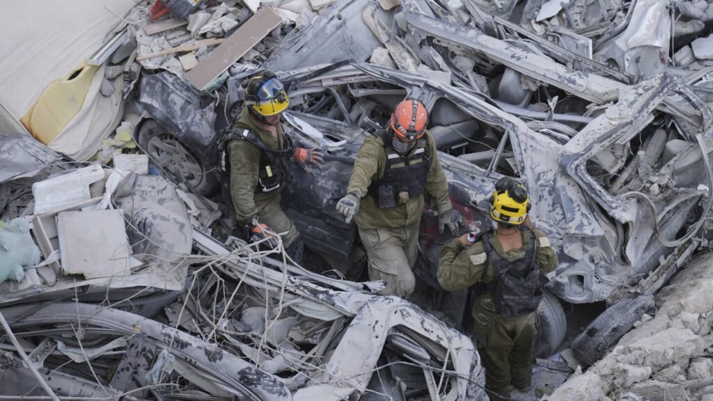 The Latest: Death toll grows as Israel and Iran trade attacks for third day