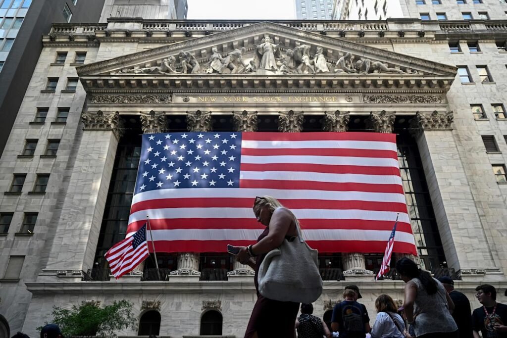 Nasdaq hits record, S&P 500 posts weekly gain, Dow slips as Wall Street shrugs off tariff tensions