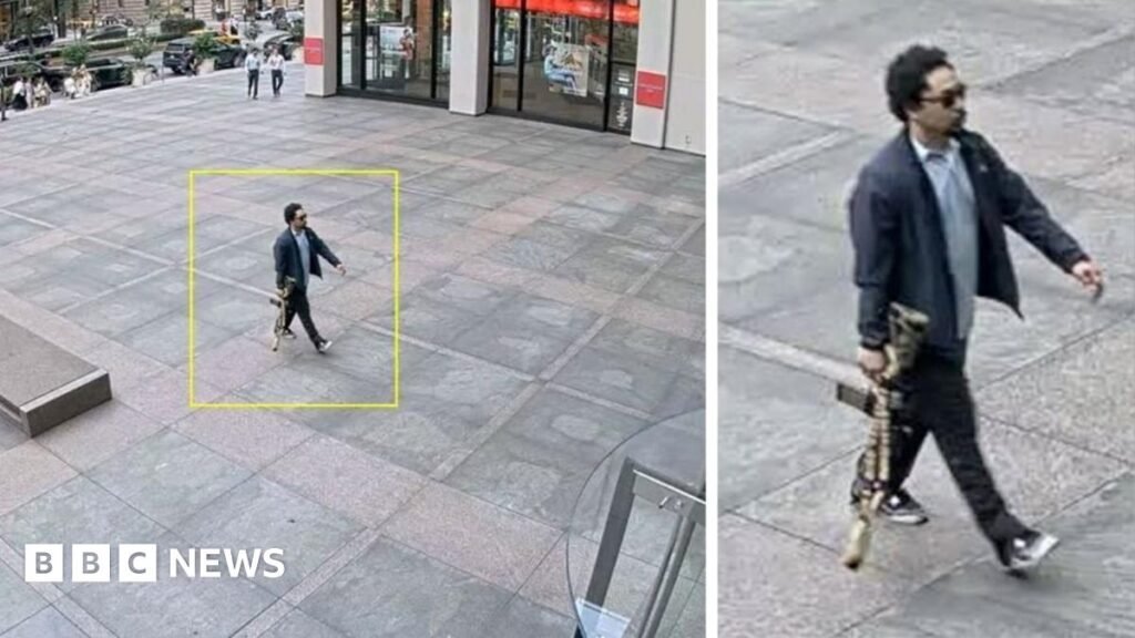 The suspect is seen on surveillance video entering the building with a rifle in his hand.