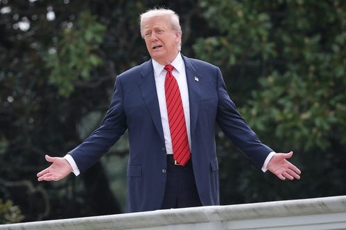 President Donald Trump answers questions from reporters as he tours the roof of the West Wing of the White House on Aug. 5, 2025.