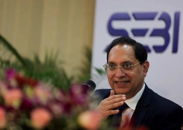 SEBI Board Meeting Live Updates: Sebi chief has some positive news on NSE IPO; Minimum Public Offer norms revised, FPI access eased; REITs get equity status